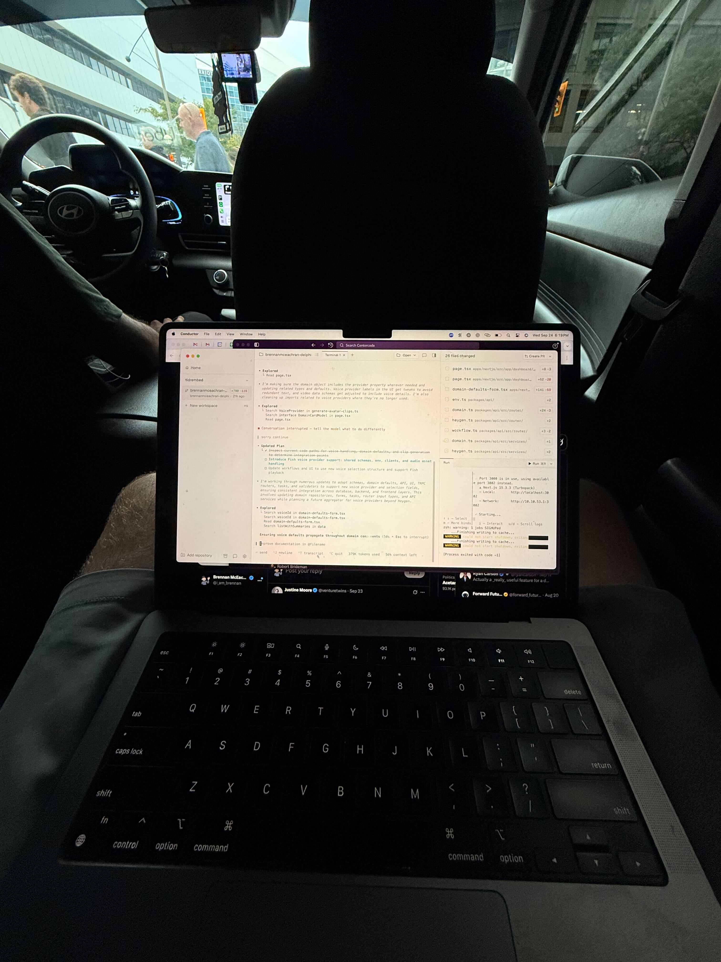 Back seat of an Uber with laptop open, Conductor.build running GPT-5-Codex; session logs on left, changes panel on right.
